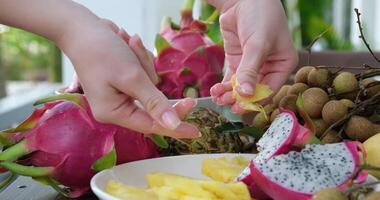 Clumsy Chef Unsuccessfully breaking a piece of pineapple, a piece of fruit falls on the ground, bad performance video