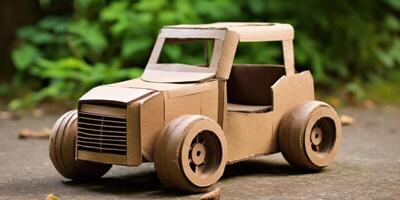 Handmade Cardboard Car Model with Greenery in the Background. Eco Friendly Kid Toy. photo