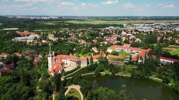 Aerial side view of chateau Pruhonice and pond in Czechia in June 2024 video