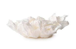 Front view of screwed or crumpled tissue paper ball after use in toilet or restroom isolated on white background photo