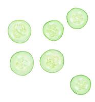 Top view set of green cucumber slices or pieces in circle shape scattering isolated on white background with clipping path photo
