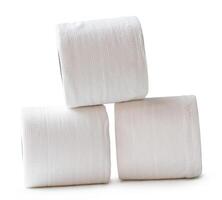 Side view of white tissue paper rolls in stack isolated on white background with clipping path photo