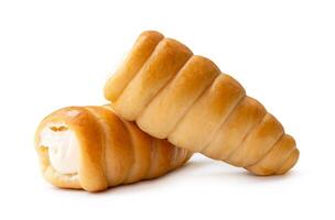 Front view or side view of puff pastry cream horn in stack isolated on white background with clipping path photo