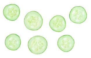 Top view set of green cucumber slices scattering isolated on white background with clipping path photo