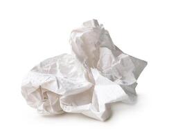 Front view of white screwed or crumpled tissue paper ball after use in toilet or restroom isolated on white backgroud with clipping path photo