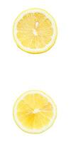 Top view set of fresh yellow lemon slices or halves scattering isolated on white background with clipping path photo