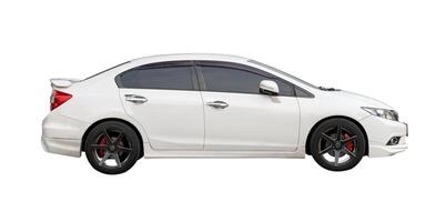 Side view of white sedan sports car isolated on white background with clipping path photo