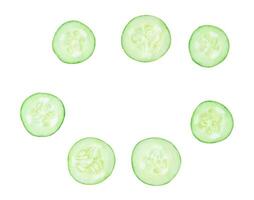 Top view set of fresh green cucumber slices or pieces scattering isolated on white background with clipping path photo