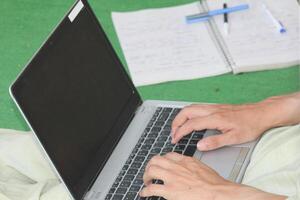 Close up image of Man hands typing on laptop computer keyboard, working, business and technology, internet network communication concept photo