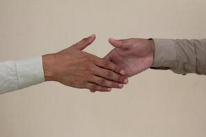 Close up two man shaking hand on white background.Athletes shaking hands before sports competition. Unity and teamwork concept. photo