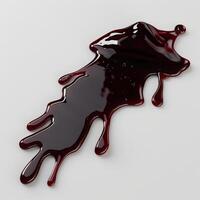 A splash of red liquid on a white background photo