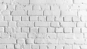 A white brick wall with a few black spots photo
