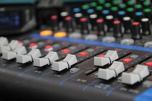 sound studio mixing desk stock photo, Audio music mixer console on a black background photo