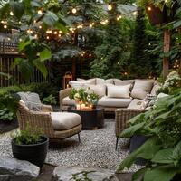 Cozy Backyard Patio with String Lights. Garden Outdoor Relaxation. Inviting patio with comfortable furniture, string lights, and lush greenery, creating a relaxing ambiance for summer outdoor evenings photo