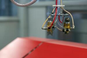 spray head in automatic paint booth photo