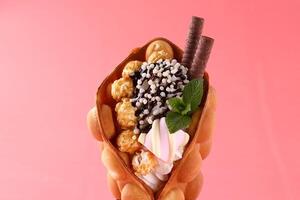 Hong kong or bubble waffle with ice cream and fruits isolated on white background photo