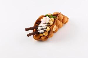 Hong kong or bubble waffle with ice cream and fruits isolated on white background photo