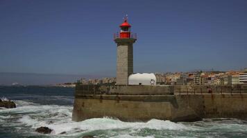 Farolim de Felgueiras lighthouse in Porto Portugal seaside. Beautiful lighthouse on the coast of Porto. Felgueiras Lighthouse, Farolim do Molhe de Felgueiras, Atlantic Ocean. video