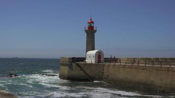 Farolim de Felgueiras lighthouse in Porto Portugal seaside. Beautiful lighthouse on the coast of Porto. Felgueiras Lighthouse, Farolim do Molhe de Felgueiras, Atlantic Ocean. video