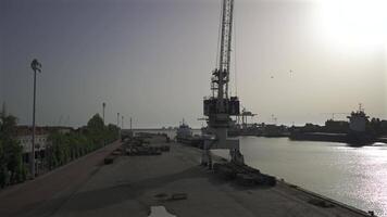 Porto, Portugal. Cargo port with cranes and workers in sunny weather in Oporto. Loading terminal with cargo ships view from the bridge. Global business logistic and transportation. video