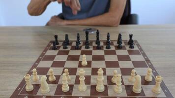 People playing chess at home and setting up the board with pieces for strategy planning and critical thinking on board game concept video
