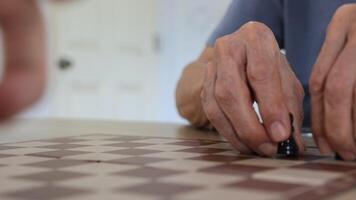 People playing chess at home and setting up the board with pieces for strategy planning and critical thinking on board game concept video