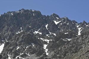 View of mountains in the Andes mountain range near Portillo in summer photo