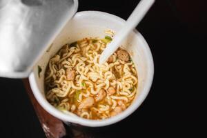 Cup of Instant Noodles with Fork photo