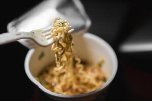 Cup of Instant Noodles with Fork photo