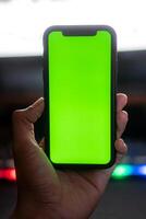 Smart phone with green screen and colorful keyboard photo
