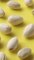 Closeup of pistachio nut seeds pattern texture background, macro pistachios nuts video