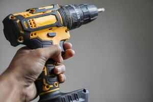 Hand Holding Cordless Power Drill photo