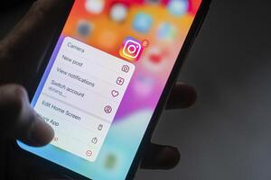 Instamatic app icon with context menu on smart phone screen photo