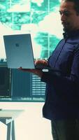 Vertical Governmental hacking team launches phishing attack to steal passwords and personal data for cyberwarfare tactics. Group of IT experts working to penetrate a database in monitoring room. Camera A. video
