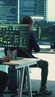 Vertical Cyber intelligence team of experts in a governmental hacking room, implementing ways to protect national secrets. Digital security, cyber surveillance and prevention of cyberterrorism. Camera A. video