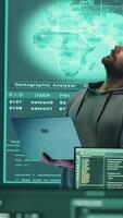 Vertical Cyber defense expert examining data on a big screen in governmental agency, focusing on cyber operations and digital security. Hacker ensures protection against cybercriminal activities. Camera A. video