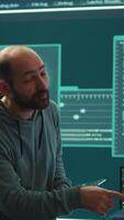 Vertical Governmental cyber defense team using advanced technology to secure information, cyber operations in high tech monitoring center. Working on data protection and threat detection. Camera A. video