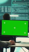 Vertical Professional team of governmental hackers conducting cyber surveillance, looks at isolated copy space screen. Expert examines cybersecurity measures and online security in high tech agency. Camera A. video