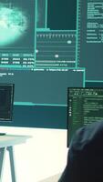 Vertical Governmental hacking group targeting sensitive information through high tech cyber attacks, digital espionage. Team of IT experts working on national security and data privacy servers. Camera A. video