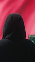 Vertical Governmental hacker in high tech office with Chinese flag shown on big screen, IT expert engaged in cyber espionage and criminal activity. Spreading fake news and brainwashing the nation. Camera B. video