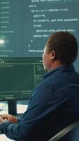 Vertical Cyber defense team working in a governmental security operations center. Experts ensuring cybercrime prevention and data breach protection, examining information on a big screen. Camera A. video