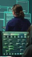 Vertical Happy cheerful hackers team gaining access inside network systems, celebrating their achievement and the step forward during hybrid war activities. Pleased experts stealing database info. Camera A. video