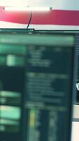 Vertical Governmental security operations center with an USA flag. Focus on cyber threat analysis, secure operations and digital forensics to protect information and ensure cyber safety. Camera A. video