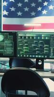 Vertical Empty cyber environment featuring the American flag on a big screen. Emphasizing cyber operations, digital safety and advanced technology for information security and cyber defense. Camera A. video