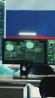 Vertical Governmental cyber operations room with Russian flag on big screen, focusing on information war and trolling. Highlighting the role of hackers in spreading disinformation and crowd control. Camera A. video