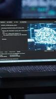 Vertical Laptop in data center establishment with artificial intelligence computing simulating human brain. Close up shot of notebook displaying AI machine learning algorithms, camera A video