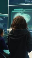 Vertical Hackers team engaging in governmental espionage and using phishing techniques for illegal access to data, working on national security breach. Spyware agency gains access on a big screen. Camera B. video