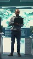Vertical Hackers group using ransomware and phishing tactics to compromise computer networks and gather intelligence for national security and protection during cyberwarfare. Governmental spyware. Camera B. video