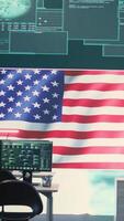 Vertical Empty cyber environment featuring the American flag on a big screen. Emphasizing cyber operations, digital safety and advanced technology for information security and cyber defense. Camera B. video