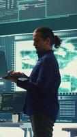 Vertical Governmental hacking team launches phishing attack to steal passwords and personal data for cyberwarfare tactics. Group of IT experts working to penetrate a database in monitoring room. Camera B. video